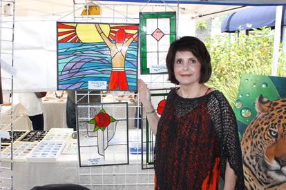 Kathy Tollman with her stained glass art